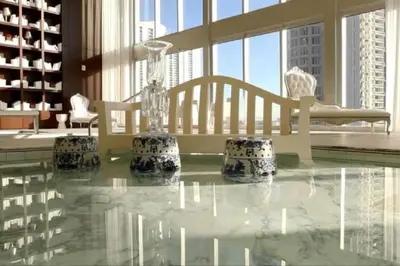 a room with a table with a glass bottle on it at 38th floor W residence with amenities in Miami