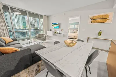 a living room with a table and a couch at Luxurious Ocean View Unit Brickell W residences in Miami
