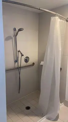 a shower with a shower curtain in a bathroom at Sunny Studio Stay, 2 Full Beds, Coastal Walks Nearby in Hallandale Beach