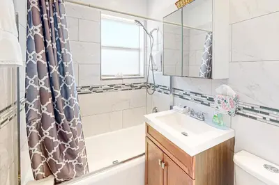 a bathroom with a sink and a tub and a shower at Eternal Coastal Sunshine in Hollywood