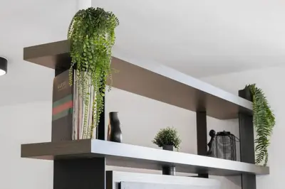 a wooden shelf with two plants on it at Corner condo w/ Unrivaled views in Miami