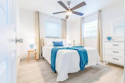 a white bedroom with a bed and a ceiling fan at Angies-10 Min Beach-10 People-Terrace-Families in Hollywood