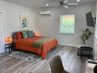 a bedroom with a bed and a ceiling fan at Casa Habana Studios in Miami