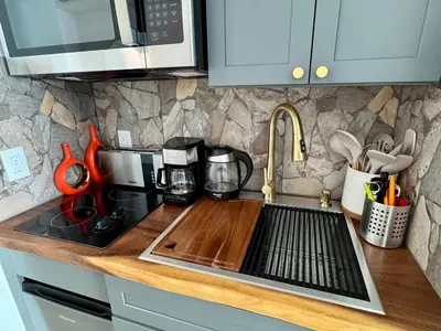 a kitchen counter with a sink and a microwave at Balcony Ocean View ! WiFi - Pool - Gym - Parking in Miami