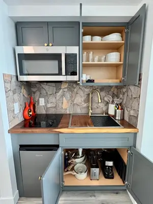 a kitchen with a sink and a microwave at Balcony Ocean View ! WiFi - Pool - Gym - Parking in Miami