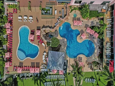an aerial view of a resort with two swimming pools at Luxury Beachfront Ocean View Beach Access-817 in Miami Beach