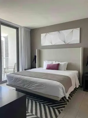 a bedroom with a large bed and a large window at Luxury 2 bedroom with ocean view in Hollywood