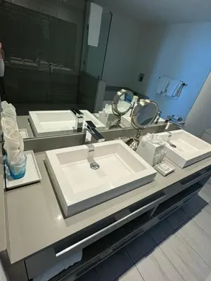 a bathroom with two sinks and a mirror at Luxury 2 bedroom with ocean view in Hollywood