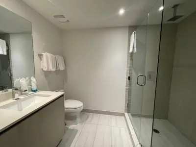 a bathroom with a shower and a toilet and a sink at Luxury 2 bedroom with ocean view in Hollywood