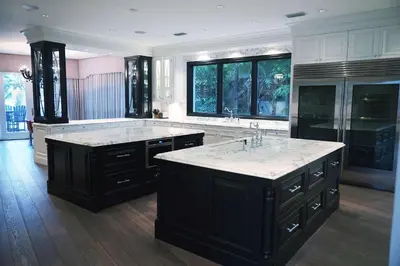 a large kitchen with two sinks and a large island at Incredible 9 Bedroom 11 Bath Idlewyld Mansion in Fort Lauderdale