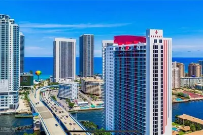 a view of a city with buildings and the ocean at Cozy Beach Apartment with Full Kitchen -A in Hallandale Beach