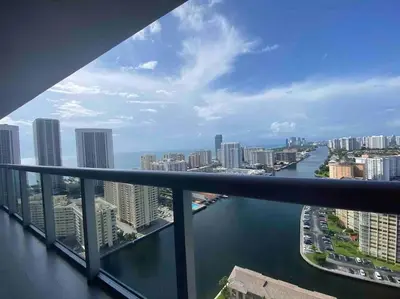 a view of a river from a balcony of a city at Cozy Beach Apartment with Full Kitchen -A in Hallandale Beach