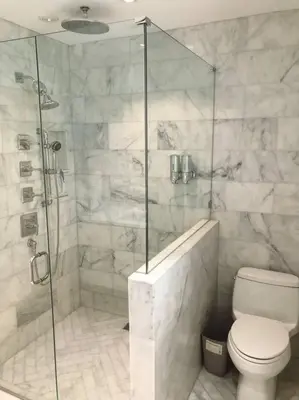 a bathroom with a toilet and a glass shower at Villa Palma-Hollywood Beach-Private Pool & Beachwalk! in Hollywood