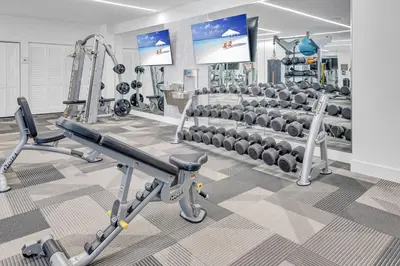 a gym with several treadmills and machines at Modern Unit in Downtown Miami With Free Parking in Miami
