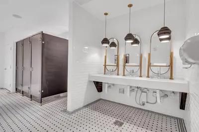 a bathroom with two sinks and two mirrors at Modern Unit in Downtown Miami With Free Parking in Miami