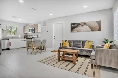 a living room with a couch and a table at Sistrunk Shades Villas #2 New Downtown Fort Lauderdale Townhomes in Fort Lauderdale