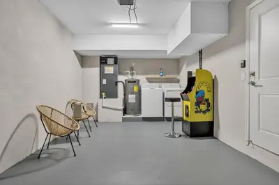 a room with chairs and a vending machine at Sistrunk Shades Villas #3 - Brand New Townhomes Downtown Fort Lauderdale in Fort Lauderdale