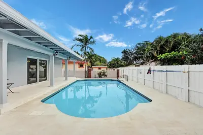 a swimming pool in the backyard of a house at Luxury Villa with Heated Pool close to Beach in Hollywood