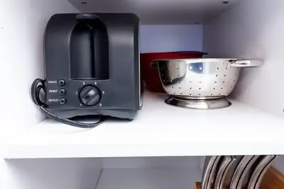 a toaster sitting on top of a counter next to a bowl at Heart Of Wilton 1 Recently Remodeled in Fort Lauderdale