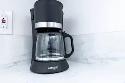 a black blender sitting on top of a counter at Heart Of Wilton 1 Recently Remodeled in Fort Lauderdale