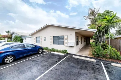 a car parked in a parking lot in front of a house at Heart of Wilton 3 Recently Remodeled in Fort Lauderdale