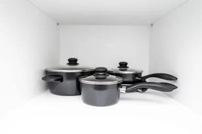 two pots and pans sitting on a counter at Heart of Wilton 3 Recently Remodeled in Fort Lauderdale