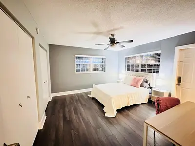 a bedroom with a bed and a ceiling fan at Ft Lauderdale - Oasis in Fort Lauderdale