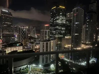 a city skyline at night with tall buildings at Skyline Serenity - Brickell On The River - Bi-Level Loft with Breathtaking Views On The Ocean in Miami