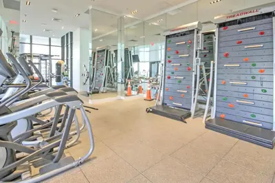 a gym with cardio equipment in a gym at Lunabase Tropical Refuge in Miami