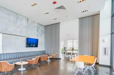 a lobby with a couch and chairs and a table at Lunabase Tropical Refuge in Miami