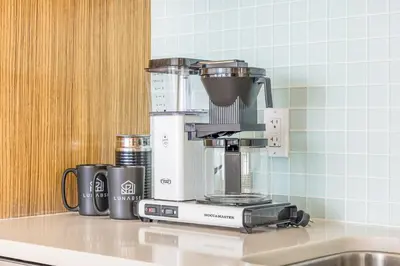a coffee maker sitting on a kitchen counter at Lunabase Waterfront Paradise in Miami