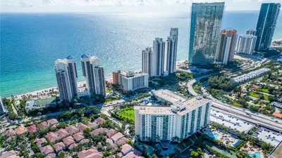 an aerial view of a city and the ocean at Family Beach Home w Ocean & Bay Views - Upgraded Corner Unit in Miami Beach