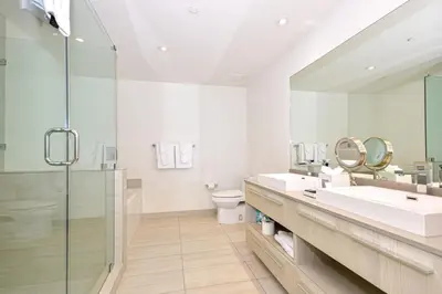 a bathroom with two sinks and a shower at Oceanview 2BR Suite At Hyde Beach House - 5☆ Amenities in Hollywood