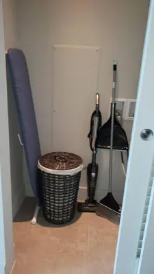 a room with a wicker trash can and two surfboards at Amazing Studio Located in Upscale-Prime Location. Walking Distance to Restaurant in Miami