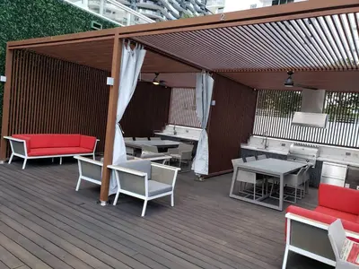 a wooden deck with tables and chairs on it at Amazing Studio Located in Upscale-Prime Location. Walking Distance to Restaurant in Miami