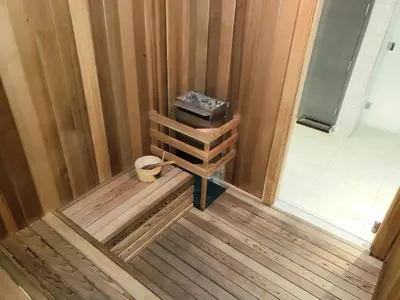 a room with a wooden wall with a wooden bench at Amazing Studio Located in Upscale-Prime Location. Walking Distance to Restaurant in Miami