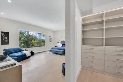 a living room with a bed and a closet at Villa in Coral Gables with Pool Jacuzzi Game Room in Miami
