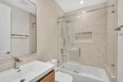 a bathroom with a shower and a sink and a toilet at Villa in Coral Gables with Pool Jacuzzi Game Room in Miami