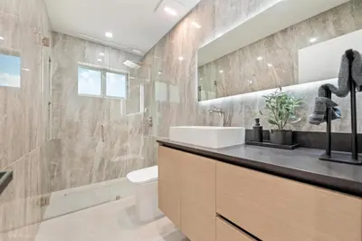 a bathroom with a sink and a toilet at Miami Paradise - Htd Pool, Mini Golf, Playground, BBQ, Arcade Machine, baby items in Miami