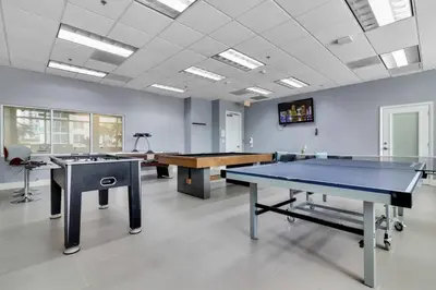 a room with two ping pong tables in it at 3BR Penthouse with European Flair n Amazing Views in Miami