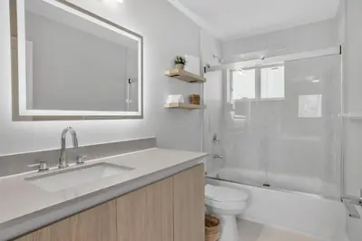 a bathroom with a sink and a toilet and a shower at Sistrunk Shades Villa #5 - New Townhome in Downtown Fort Lauderdale in Fort Lauderdale