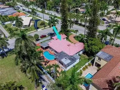 an aerial view of a house with a pink roof at Pool Paradise Half mile to Beach w Massive Yard! in Hollywood