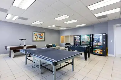 a room with a ping pong table and a piano at Glam Studio: Sleeps 4 x Pool x Gym x Parking in Miami