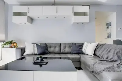a living room with a couch and a table at Chic Penthouse: 3BR x Pool x Gym x 2 Parking Spots in Miami