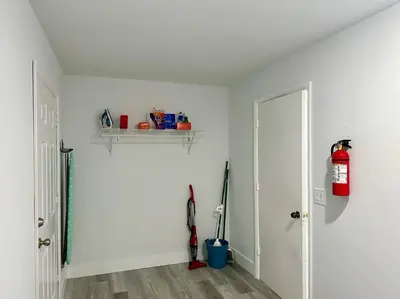 a white room with a fire hydrant and a door at Oasis in Plantation South Florida in Plantation