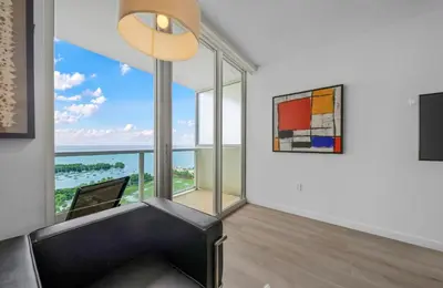 a living room with a view of the ocean at 1-BD Condo in Coconut Grove - Water Views in Miami