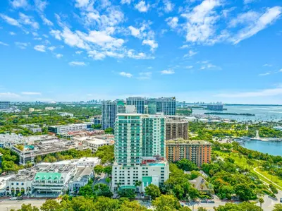 an aerial view of a city with buildings and the water at 1-BD Condo in Coconut Grove - Water Views in Miami