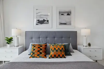 a bedroom with a bed with two pillows on it at LUX 2B-2B at ICON - Water View & 5-Star Amenities in Miami