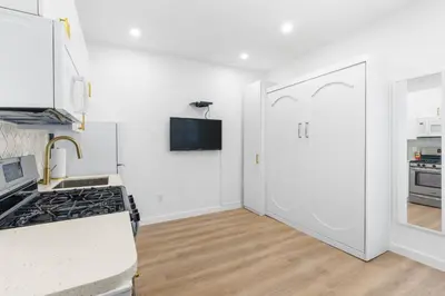 a kitchen with a stove and a white door at 316 Footloose #1 in Hollywood