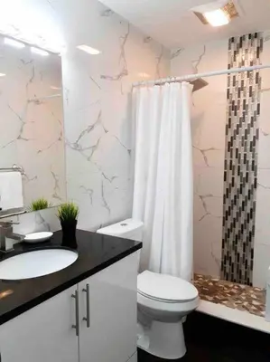 a bathroom with a toilet and a sink and a shower at GREAT LOCATION Downtown/Airport/South Beach in Miami